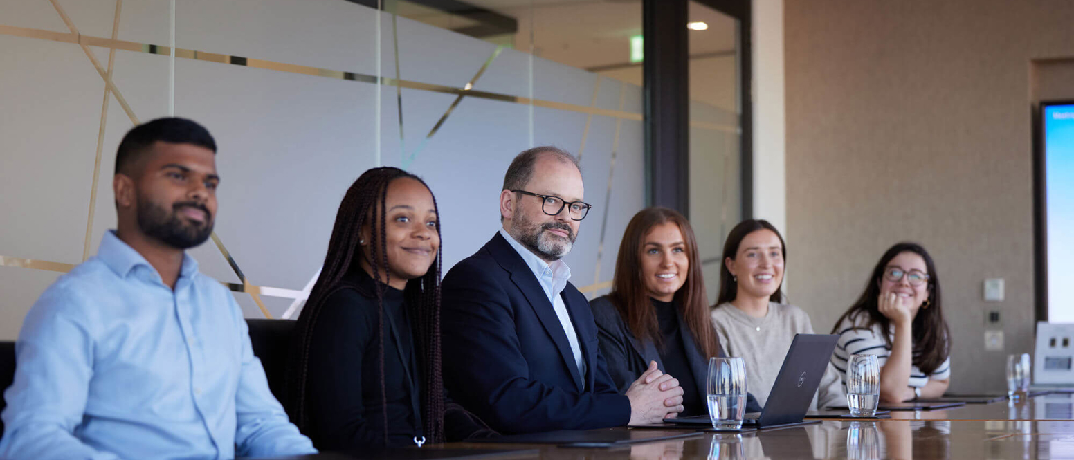 People sitting around a board table